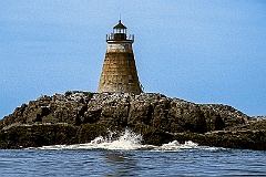 Saddleback Ledge Light Over Rocky Island Shore